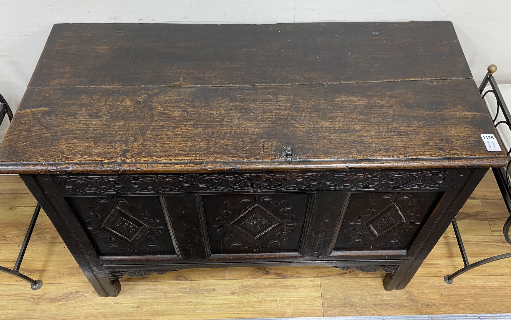 A late 17th century oak coffer the front carved with three lozenge medallion panels, length 115cm, depth 51cm, height 74cm